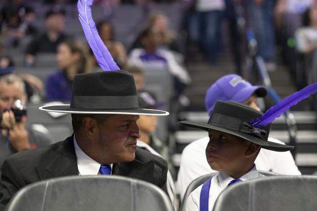 Mario and Isaiah Serrano, right, attend Lowrider Night at Golden 1 Center in Sacramento on Sunday, March 15. According to Mario Serrano, the two were happy to represent lowrider culture and have been participating in lowrider culture for three generations.